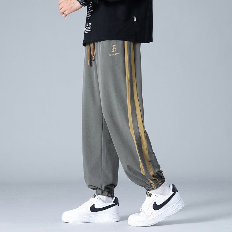 Pantalones Jogger de Corte Relajado "Urban Flow" – Estilo Versátil con Rayas Laterales