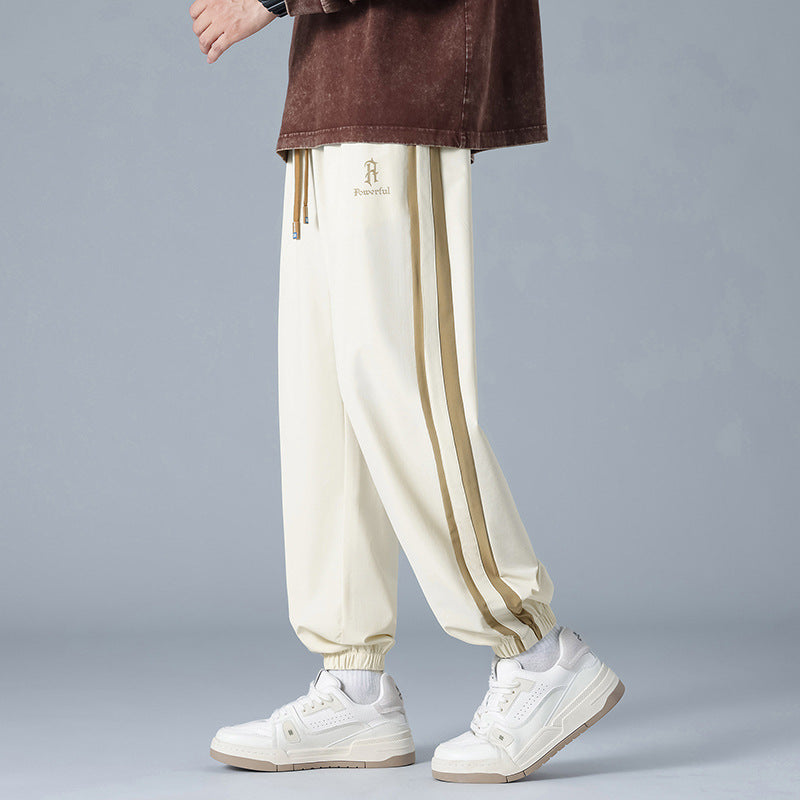 Pantalones Jogger de Corte Relajado "Urban Flow" – Estilo Versátil con Rayas Laterales